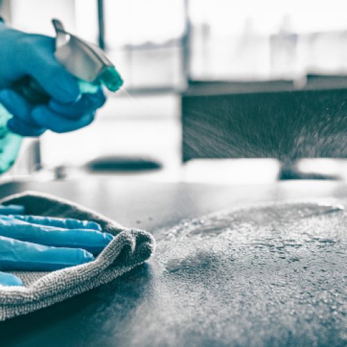 Cleaning,Home,Table,Sanitizing,Kitchen,Table,Surface,With,Disinfectant,Spray